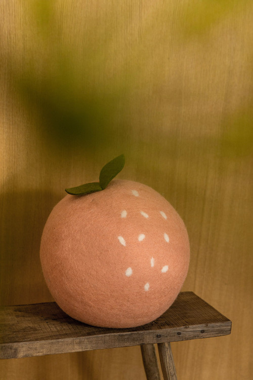 Felt peach pouffe: playful seating for children