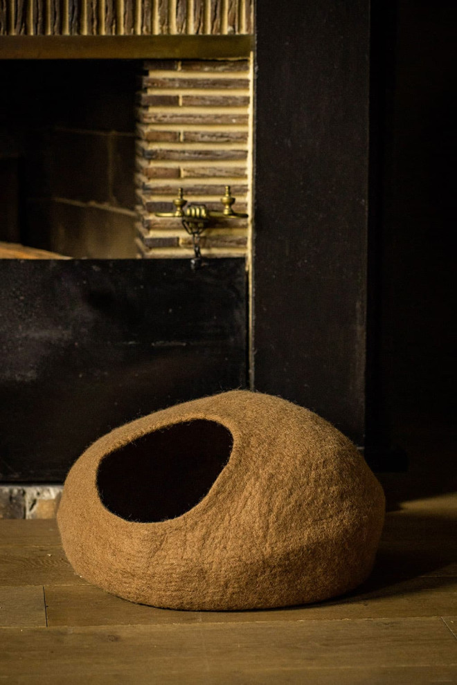 A decorative cat basket installed on a hallway floor