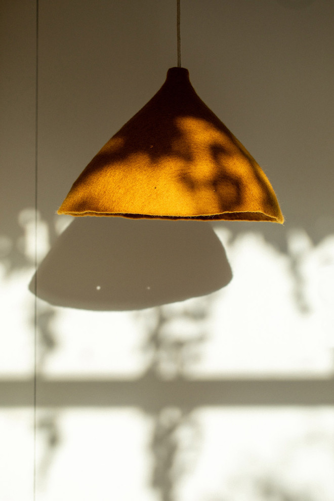 Large perforated felt shade: a pendant light for the dining room