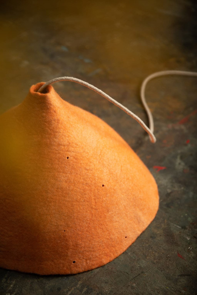 Large perforated felt shade: a pendant light for the dining room