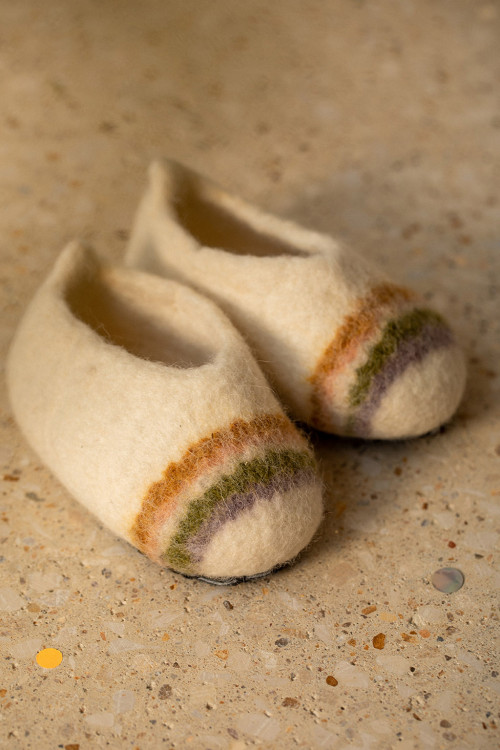 A pair of handmade felt slippers for children