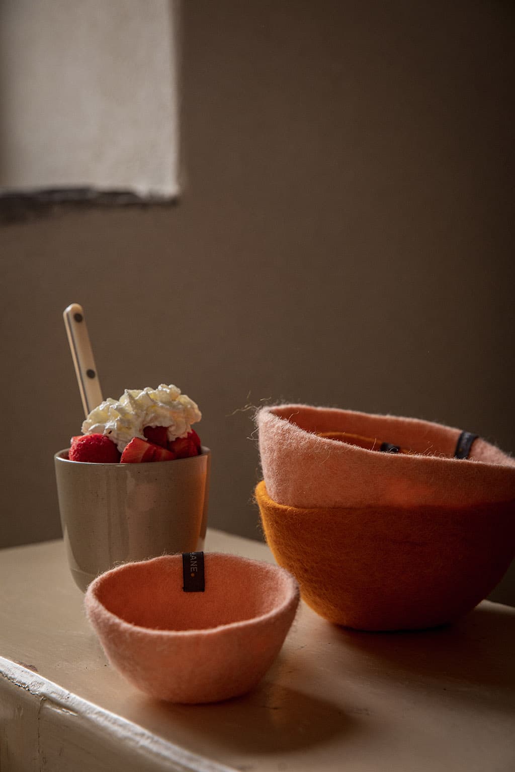 Small pink and orange felt bowls