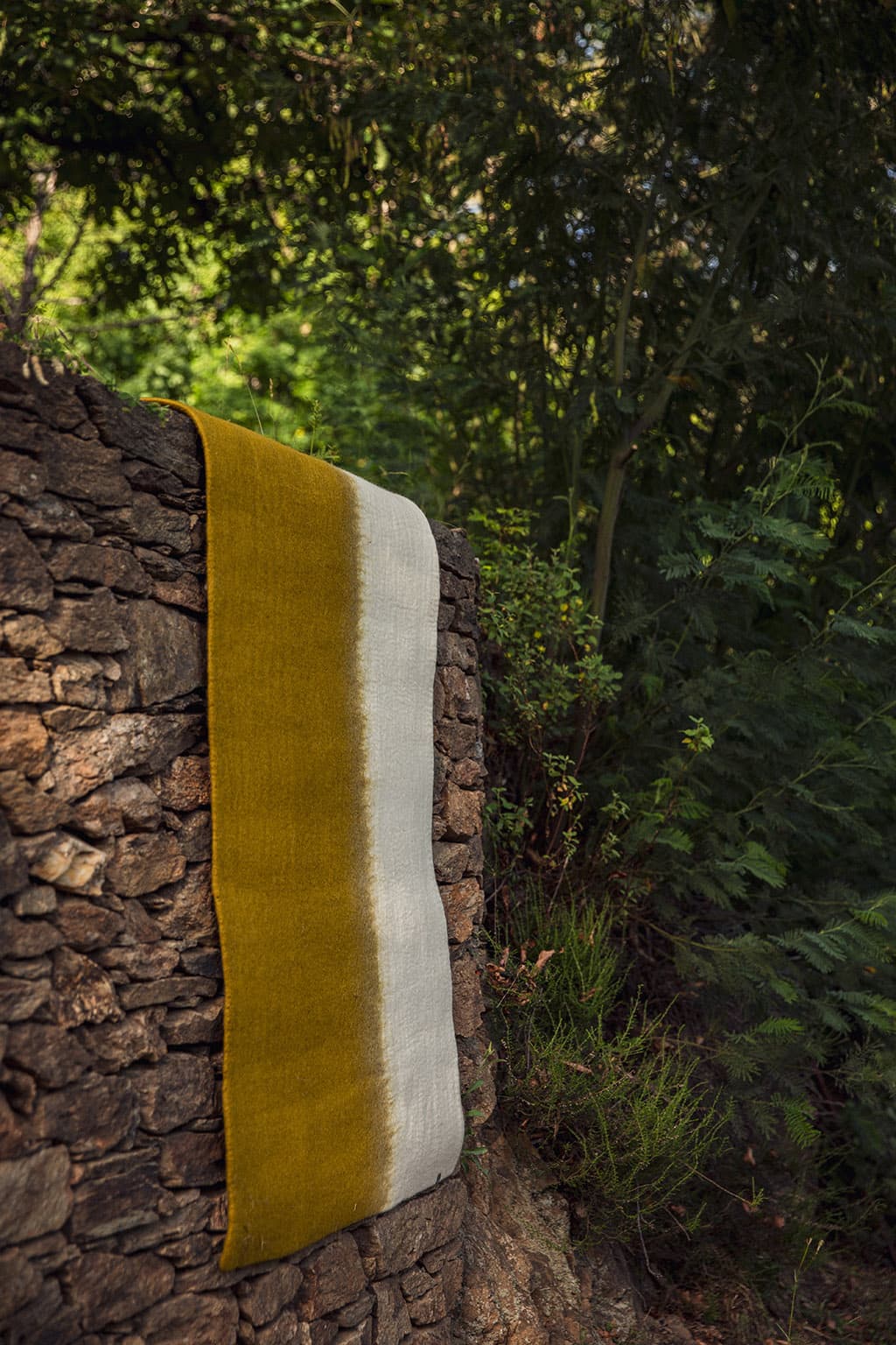 Long rectangular two-tone green and white wool rug